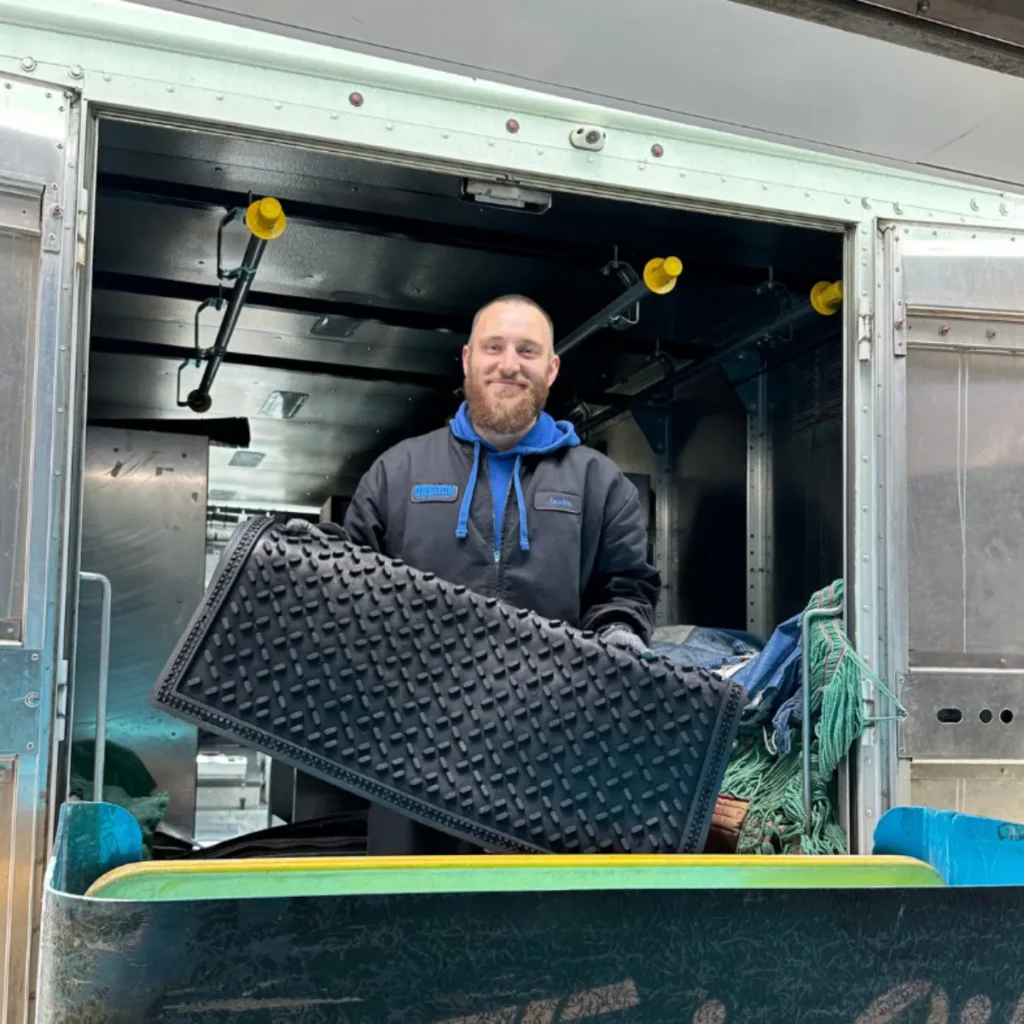Worker holding a mat