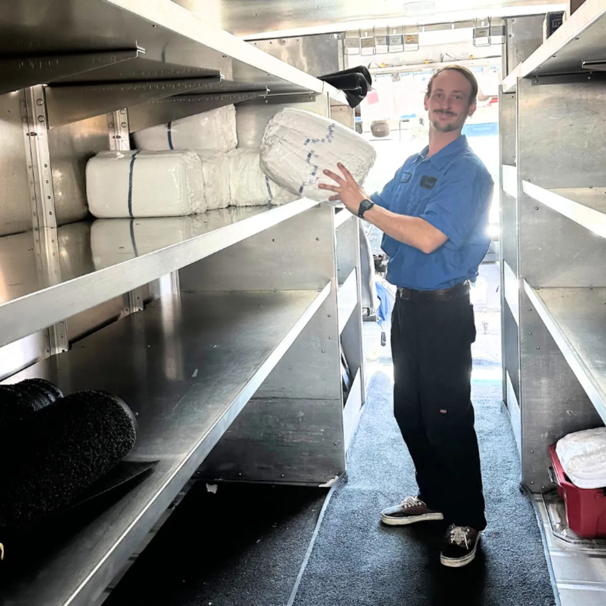 Worker loading a delivery truck